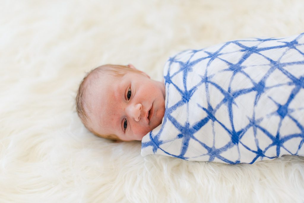 newborn baby boy on soft blanket