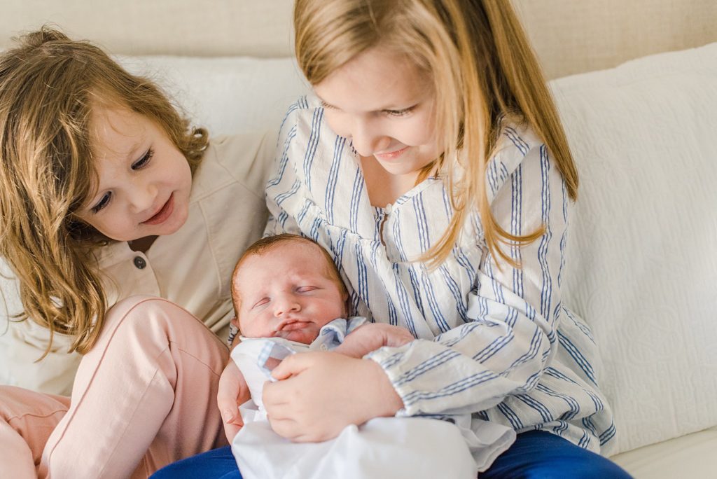 newborn baby boy and sisters