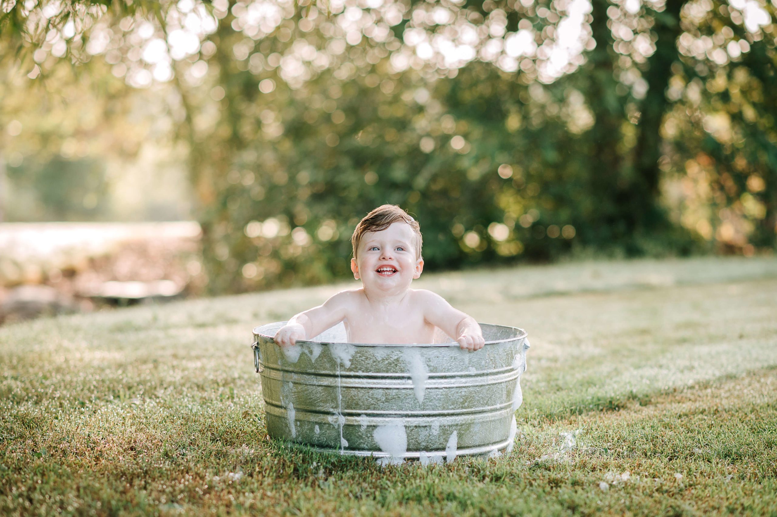 boy in outdoor bubble bath